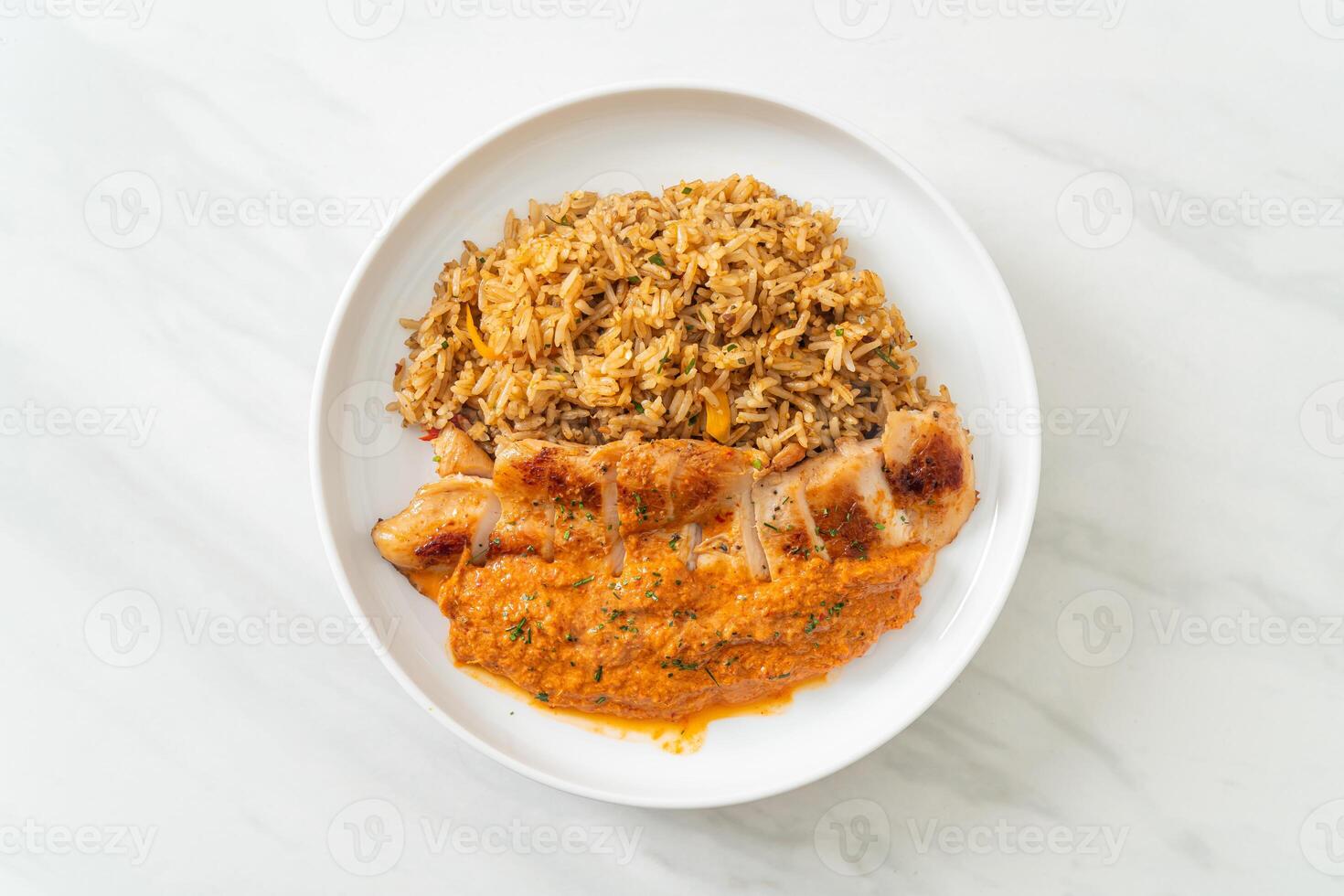 grilled chicken steak with red curry sauce and rice photo