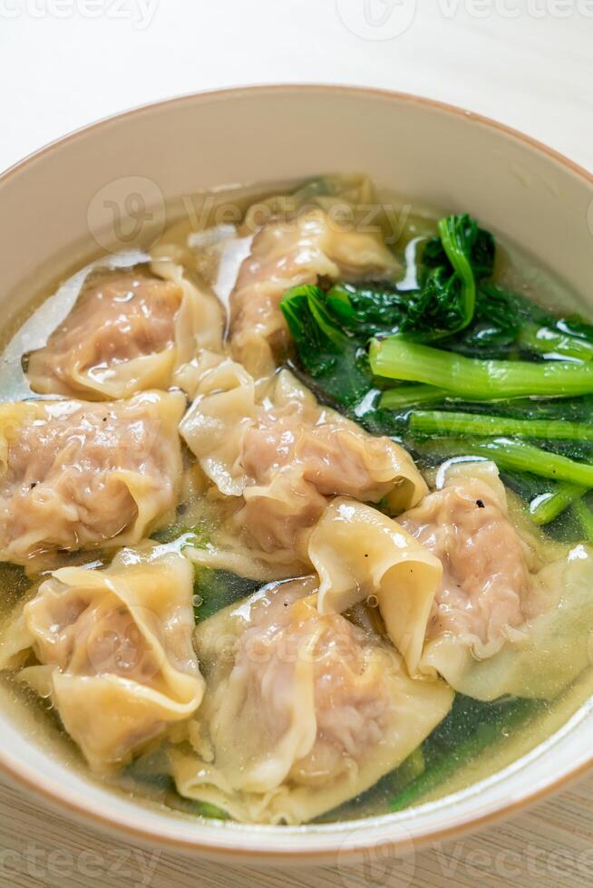 pork wonton soup or pork dumplings soup with vegetable photo