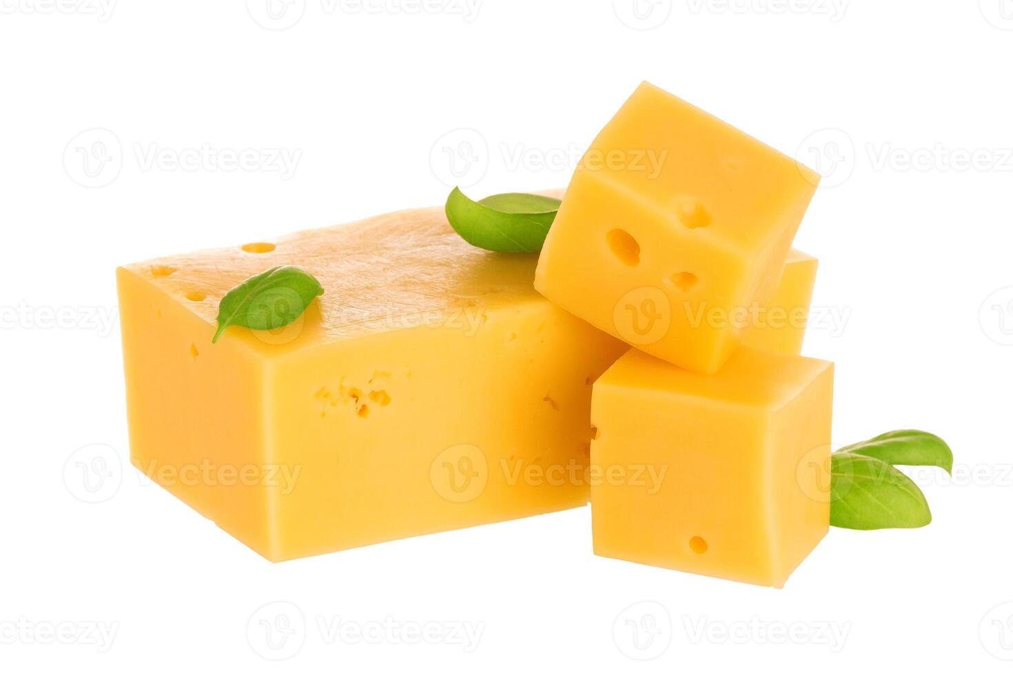 Heap of cheese cubes isolated on white background. With clipping path. photo