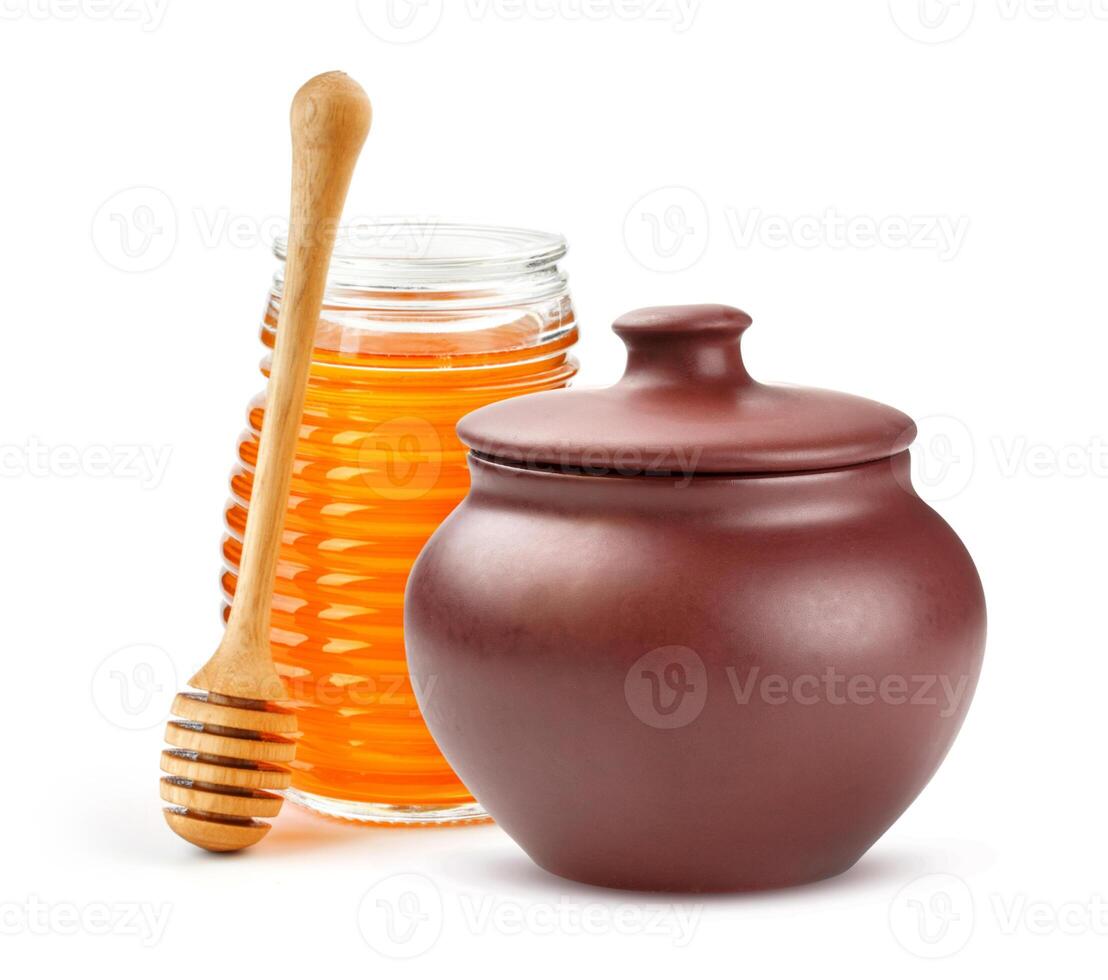 Clay Honey pot and glass jar isolated on white background photo