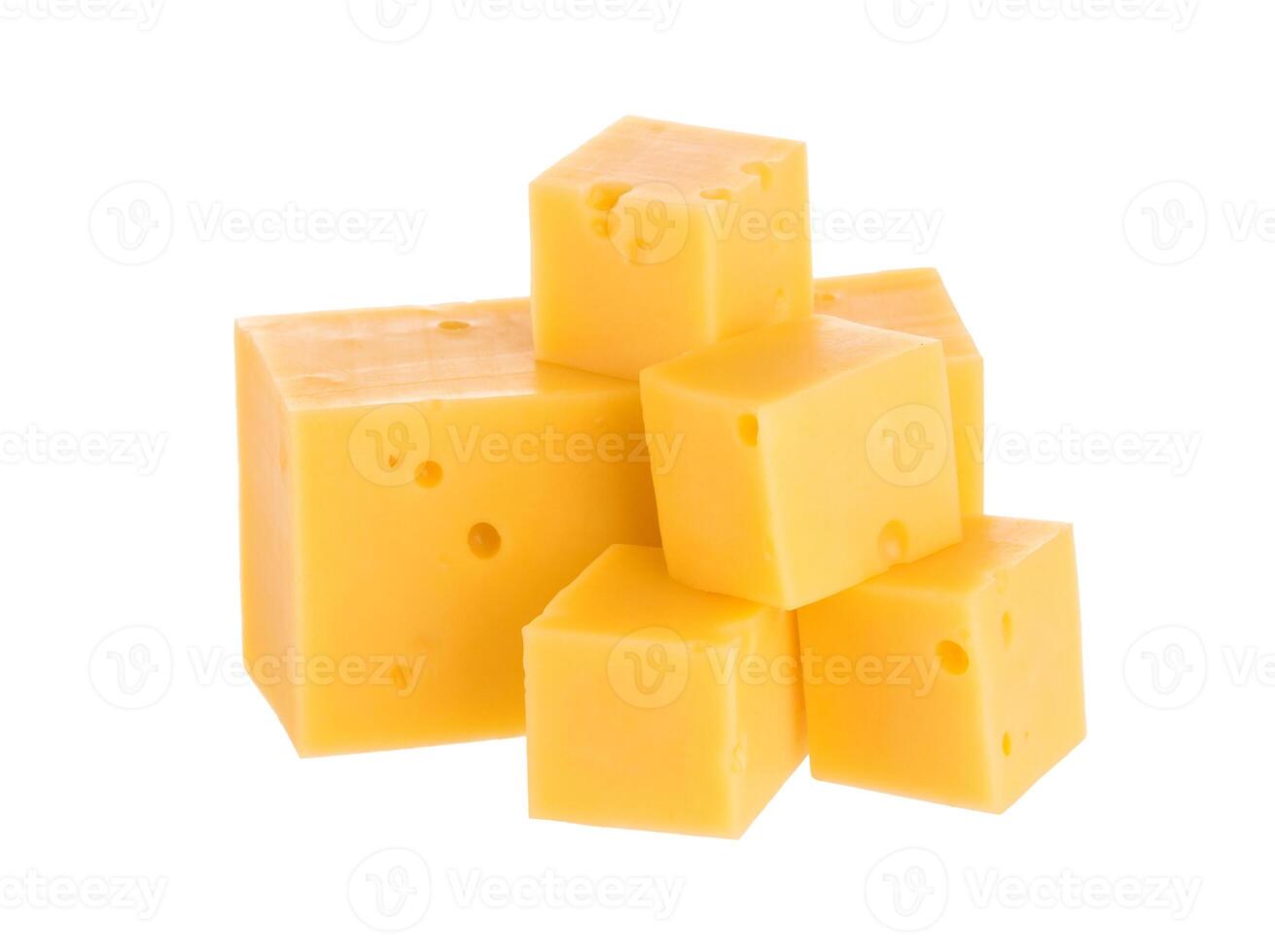 Heap of cheese cubes isolated on white background. With clipping path. photo