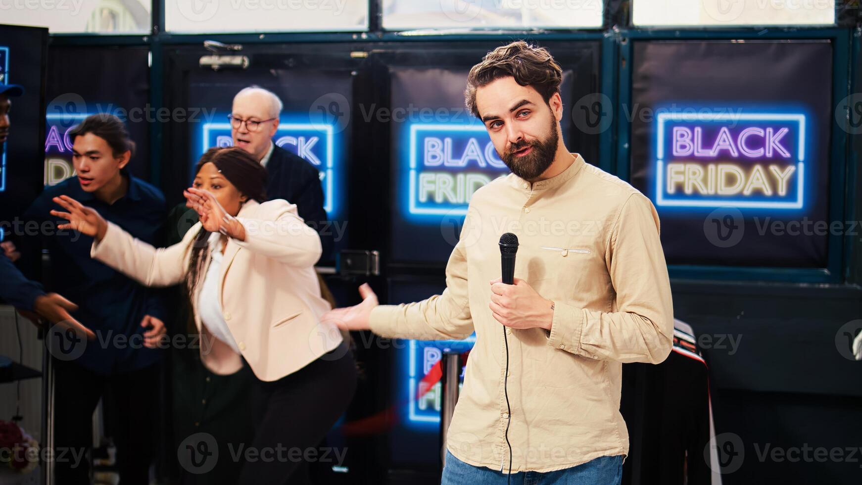 Television reporter in crowded store transmitting live newd on black friday, producing newscast with microphone at scene. Clothing store owner launching start of seasonal discounts. photo