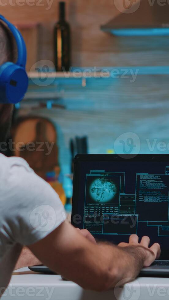 Unsuccessful trying of hacker to steal from company server annoying the man while working from home. Programmer writing a dangerous malware for cyber attacks using performance device during midnight. photo