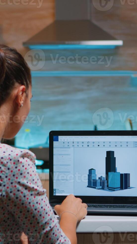 Designer using cad software to design a 3D concept of buildings working remotely overtime from home. Engineer artist creating and studying in office new modern model, determination, career. photo