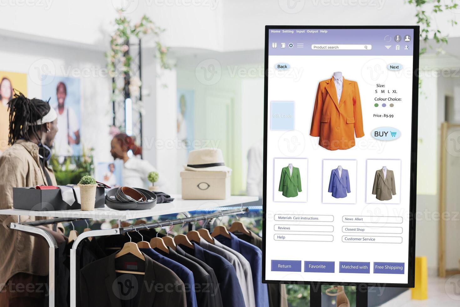 Interactive monitor board kiosk service, trendy clothing items and merchandise on display in fashion boutique at mall. Touch screen with user interface of online shop, self service checkout. photo