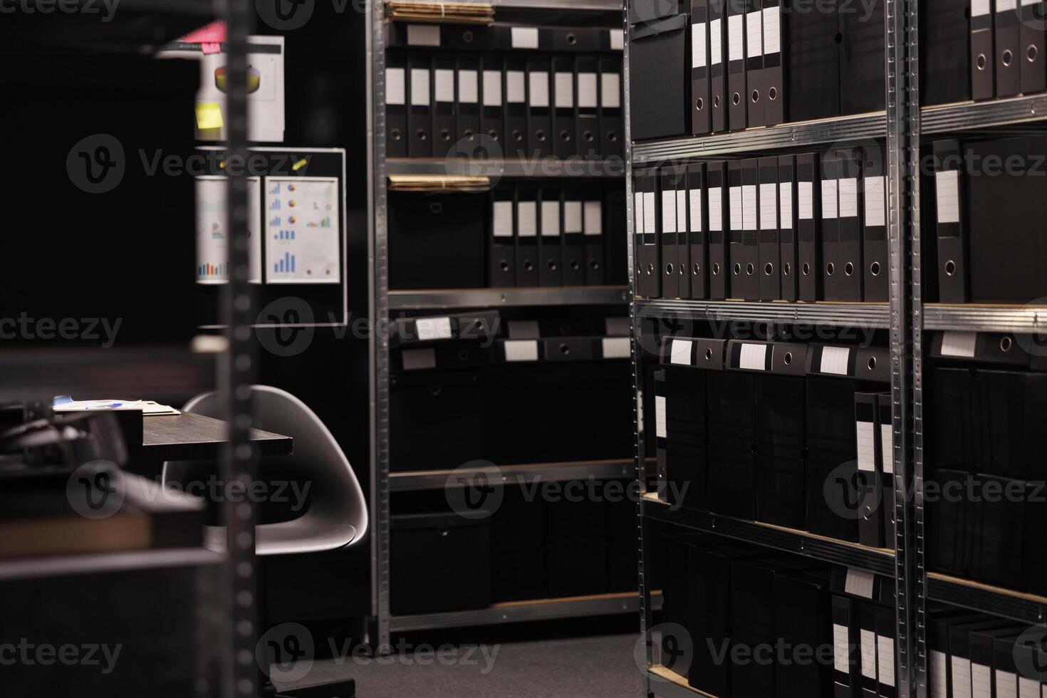 Empty detective space equipped with metallic storage full with criminal cases documents. Arhive room in police station is a secure location where crime evidence is stored during investigation photo