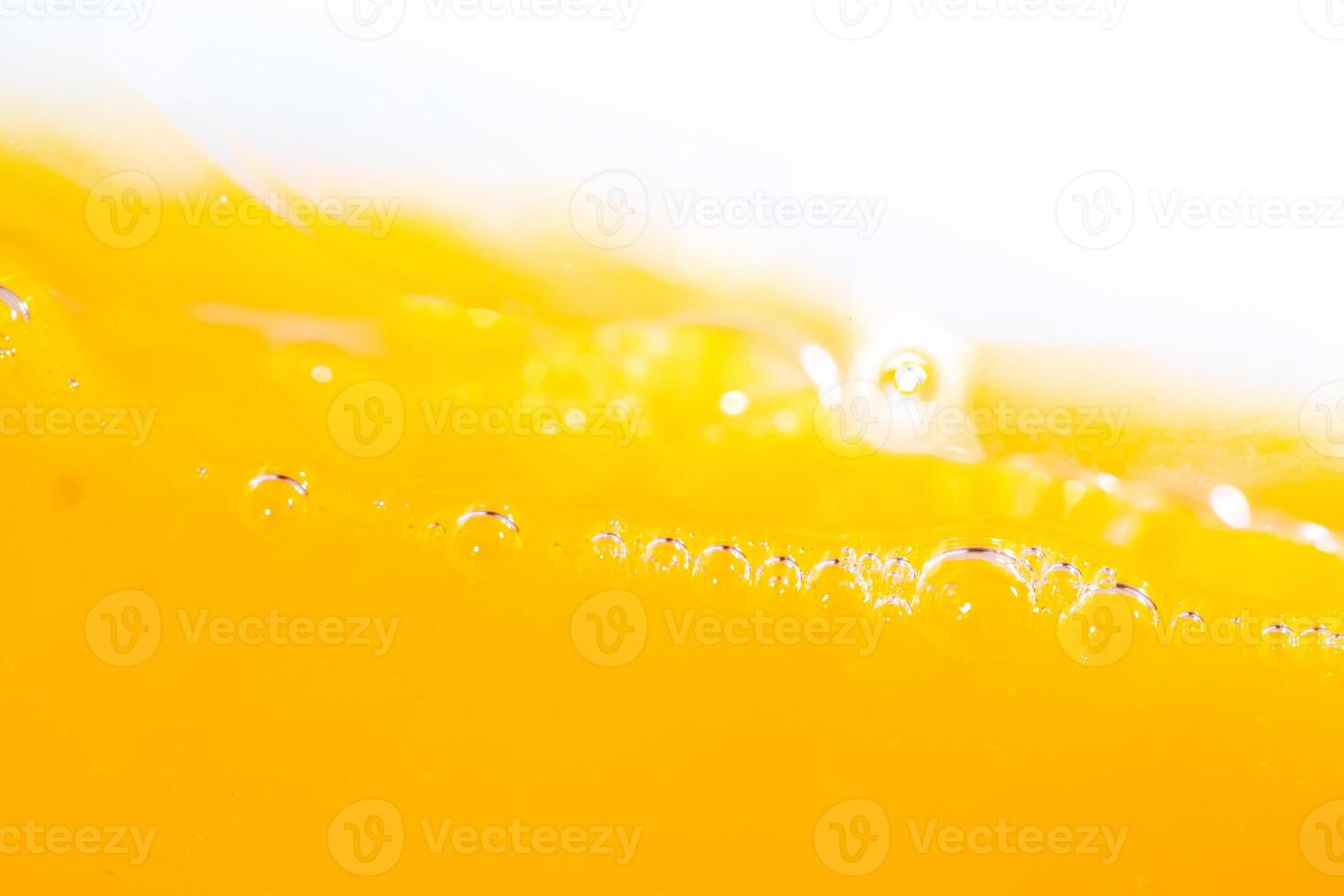 Close up bright orange juice splash texture for health and nature waves, Beautiful waves curve and little bubbles smooth for garphic design and background photo