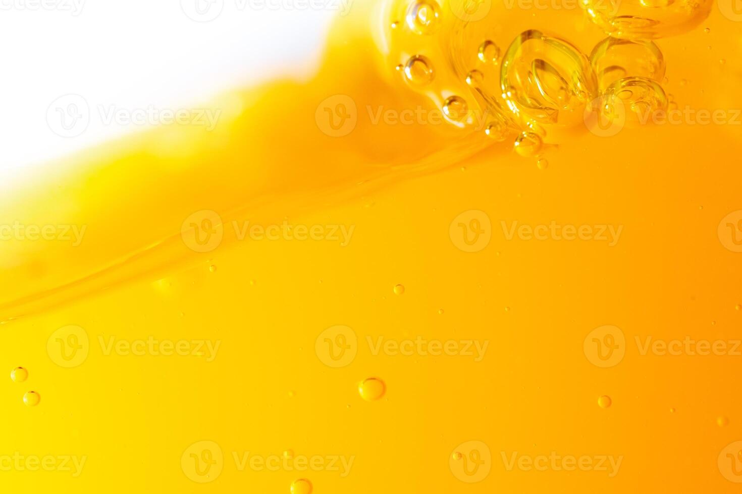 Close up bright orange juice splash texture for health and nature waves, Beautiful waves curve and little bubbles smooth for garphic design and background photo