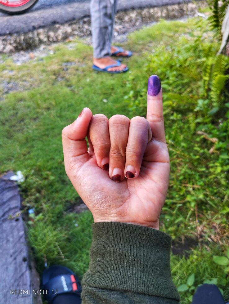 Purple ink on finger after presidential election photo