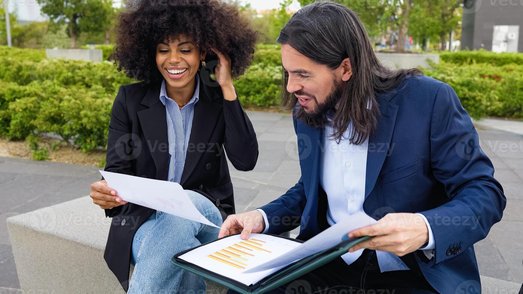 Multiracial business colleagues with an information session outside the office photo