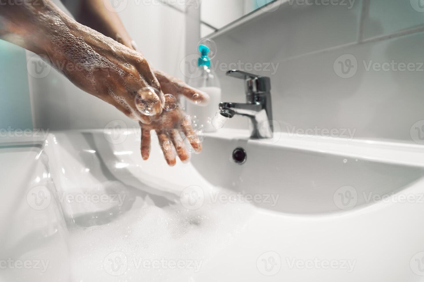 Female washing hands with liquid soap for preventing and stop corona virus spreading - Hygiene and healthcare people concept photo