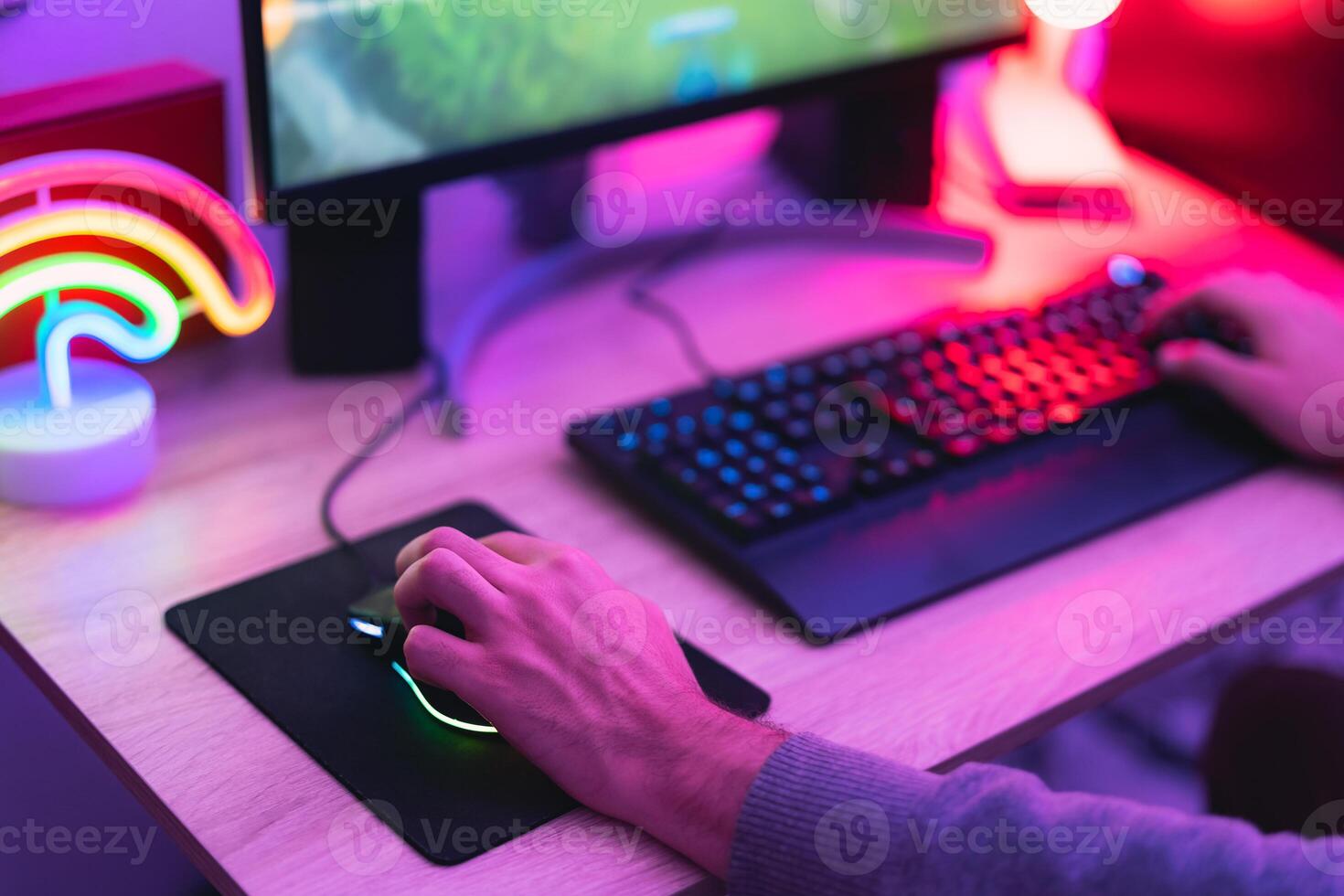 Young gamer playing online video games while streaming on social media - Youth people addicted to new technology game photo