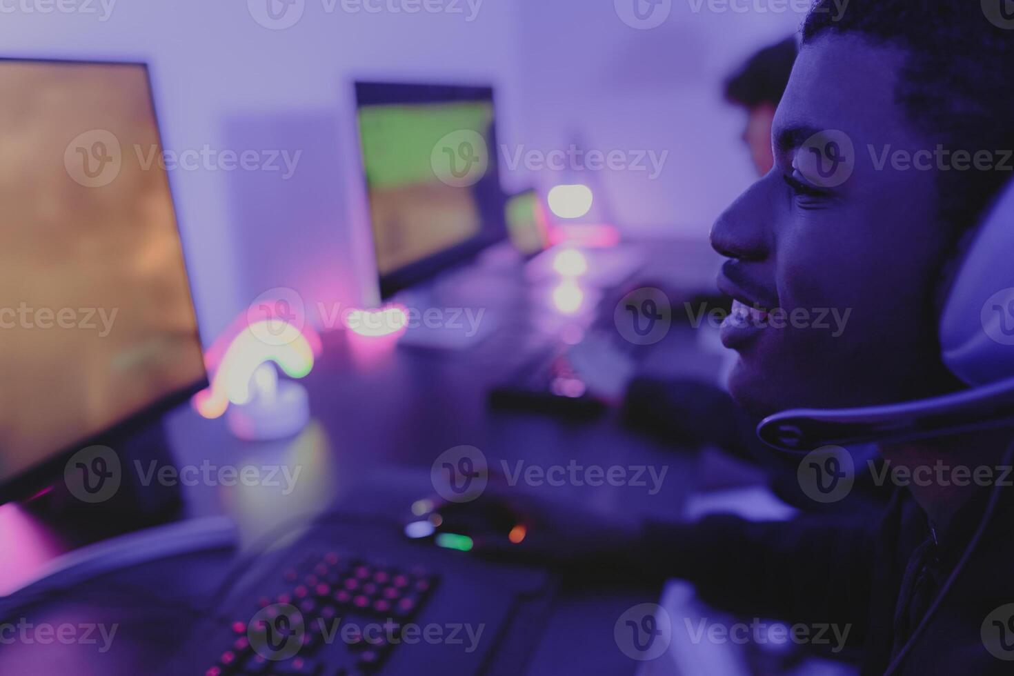 Young gamers having fun playing online video games with computer at home - Gaming entertainment and technology concept photo