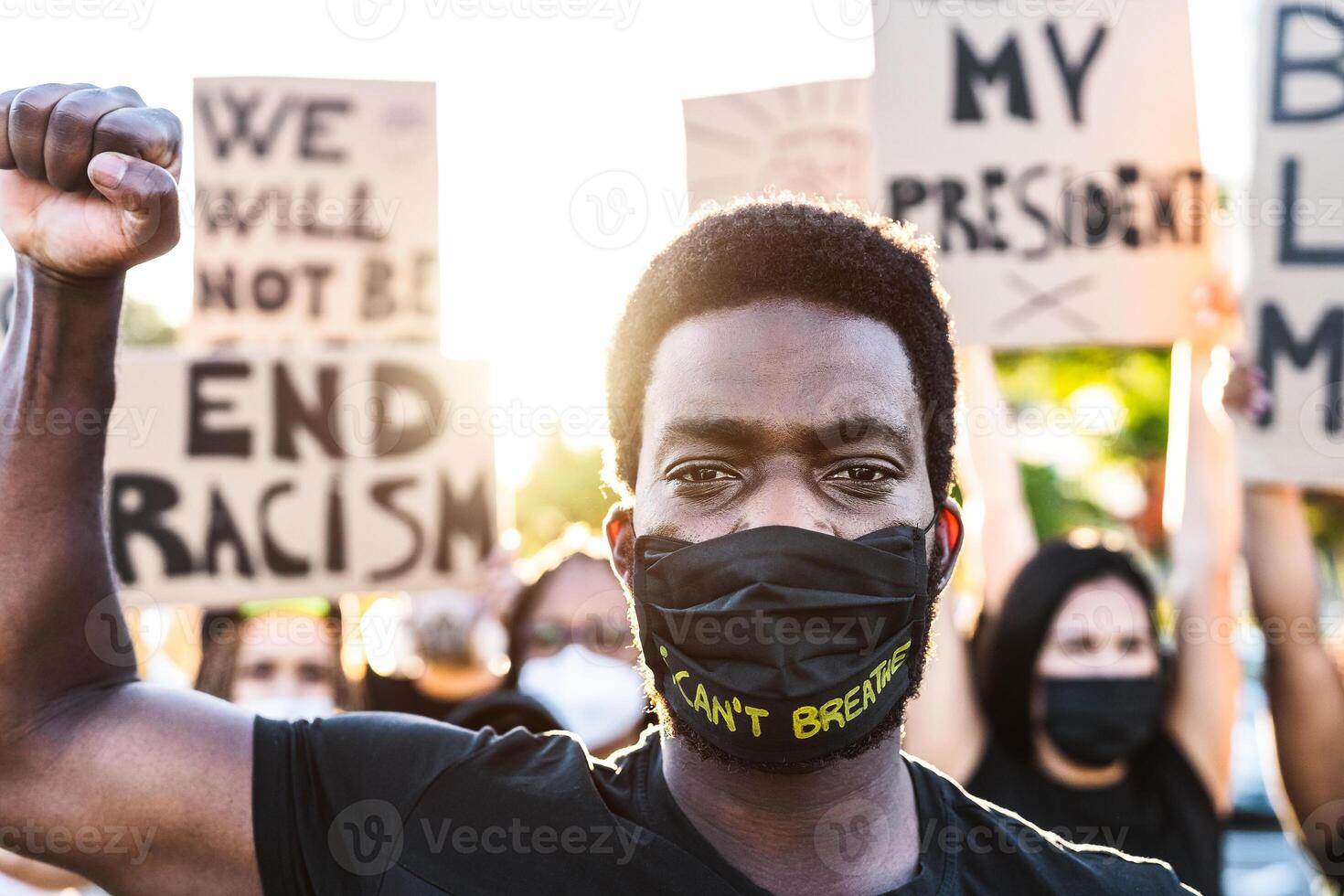 Black lives matter activist movement protesting against racism and fighting for equality - Demonstrators from different cultures and race protest on street for justice and equal rights photo