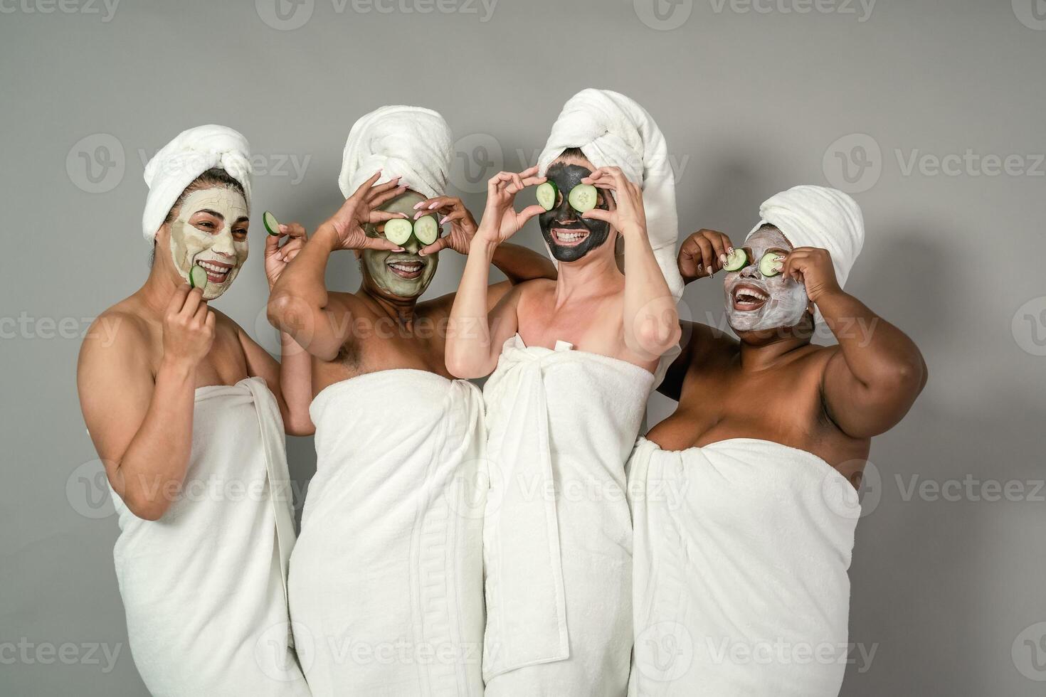 Happy multiracial females with different body size having skin care spa day - People selfcare concept photo