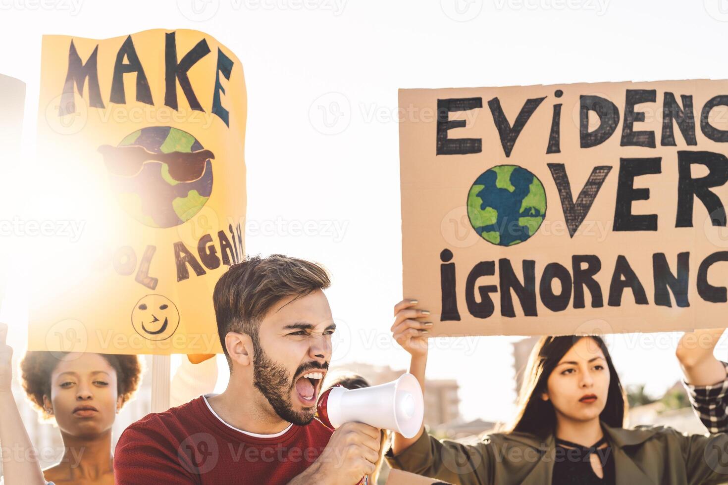 Group demonstrators protesting against plastic pollution and climate change - Multiracial people fighting on road holding banners on environments disasters - Global warming concept photo