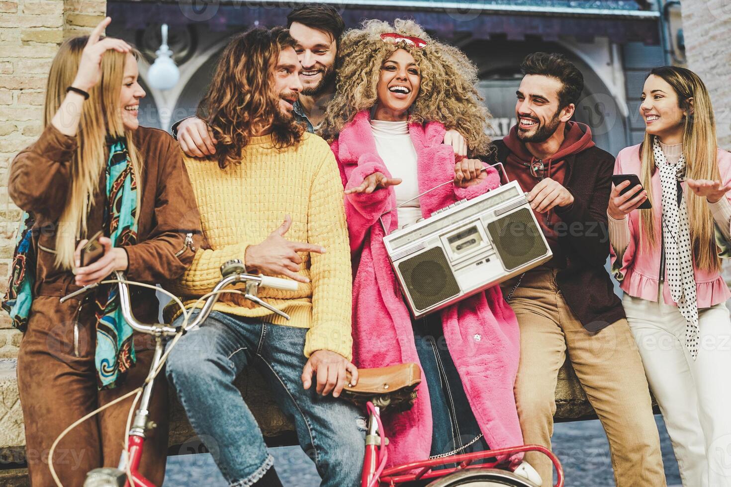 Group of friends making party listening to music with vintage boombox - Happy young people having fun with outdoor  - Generation z, millennial and youth lifestyle concept photo