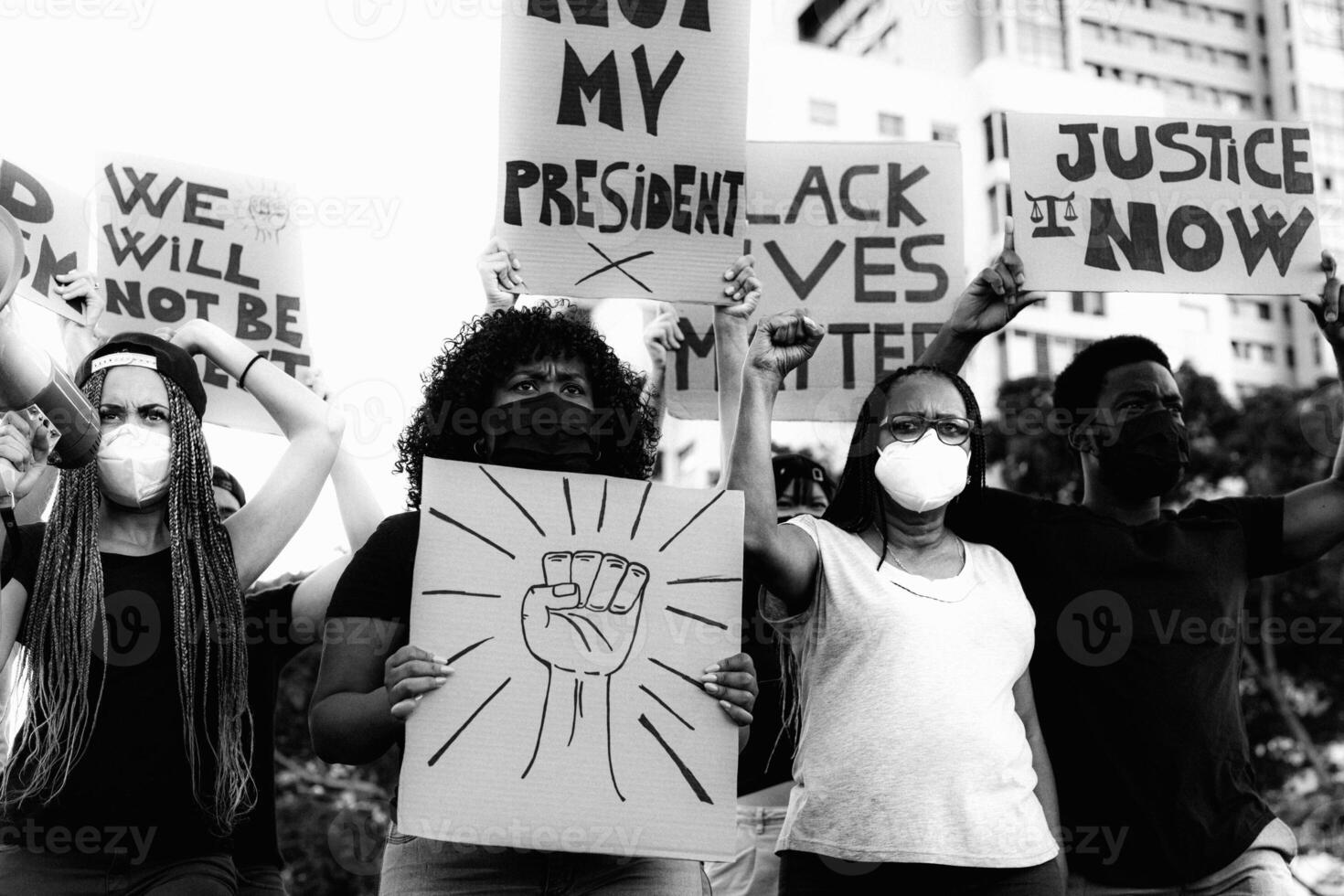 Activist movement protesting against racism and fighting for equality - Demonstrators from different cultures and race protest on street for equal rights photo