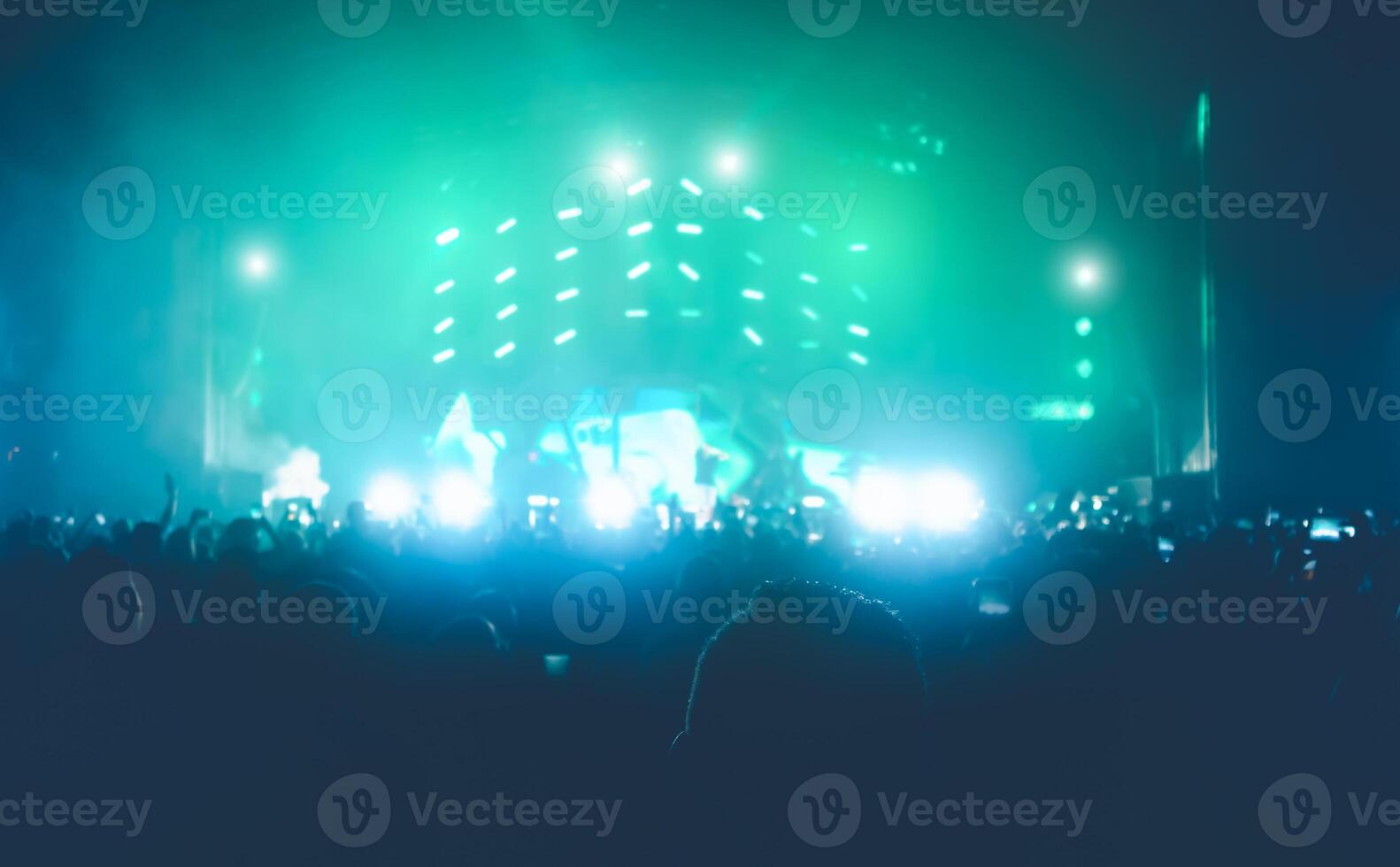 Young people dancing and having fun in music festival party outdoor - Crowd with hands up celebrating concert fest event - Disco club entertainment and youth culture lifestyle concept photo