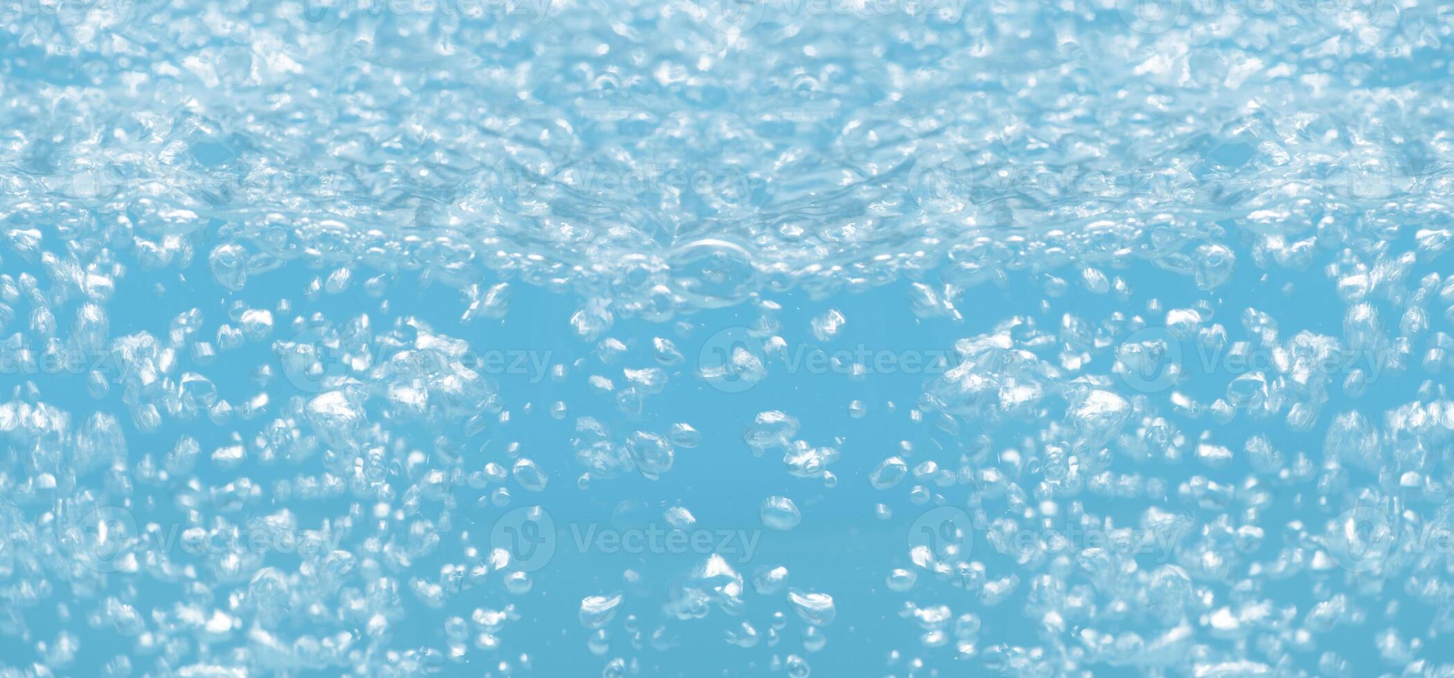 Blue water surface texture with ripples, splashes, and bubbles. Abstract summer banner background Water waves in sunlight with copy space cosmetic moisturizer micellar toner emulsion. Blue water wave. photo