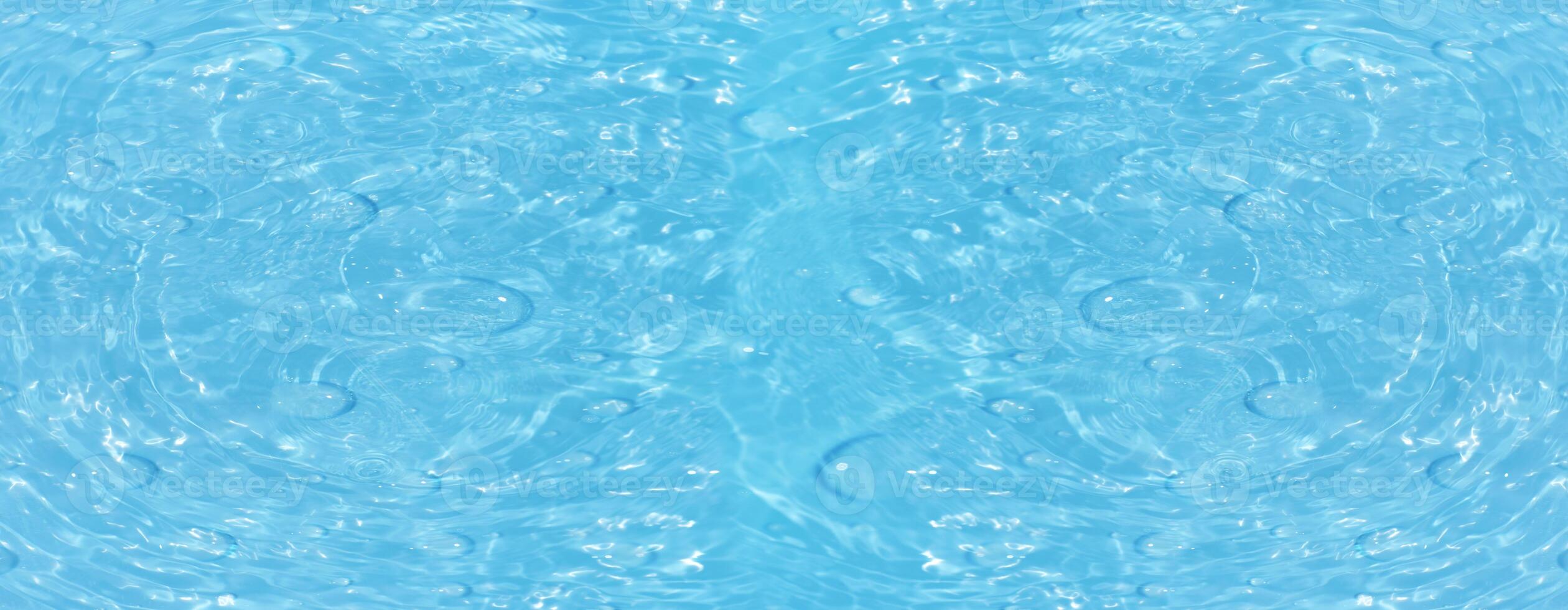Blue water surface texture with ripples, splashes, and bubbles. Abstract summer banner background Water waves in sunlight with copy space cosmetic moisturizer micellar toner emulsion. Blue water wave. photo
