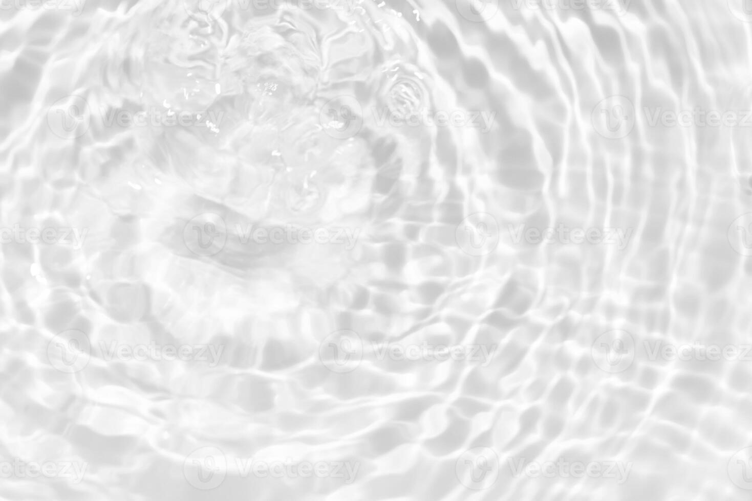 Bluewater waves on the surface ripples blurred. Defocus blurred transparent blue colored clear calm water surface texture with splash and bubbles. Water waves with shining pattern texture background. photo
