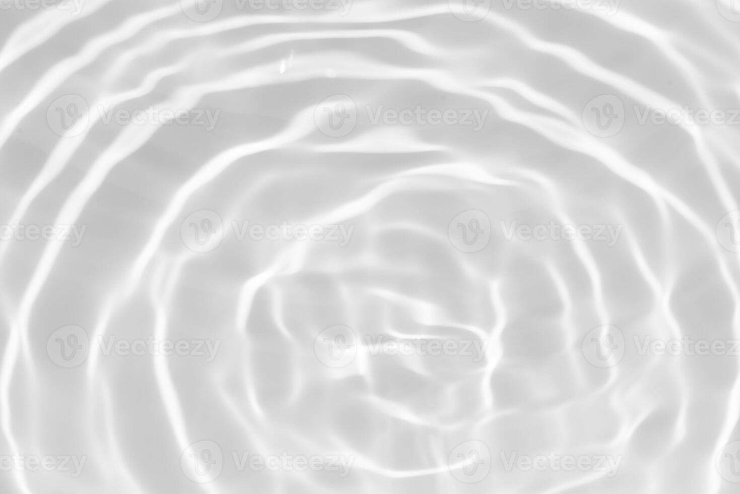 Bluewater waves on the surface ripples blurred. Defocus blurred transparent blue colored clear calm water surface texture with splash and bubbles. Water waves with shining pattern texture background. photo