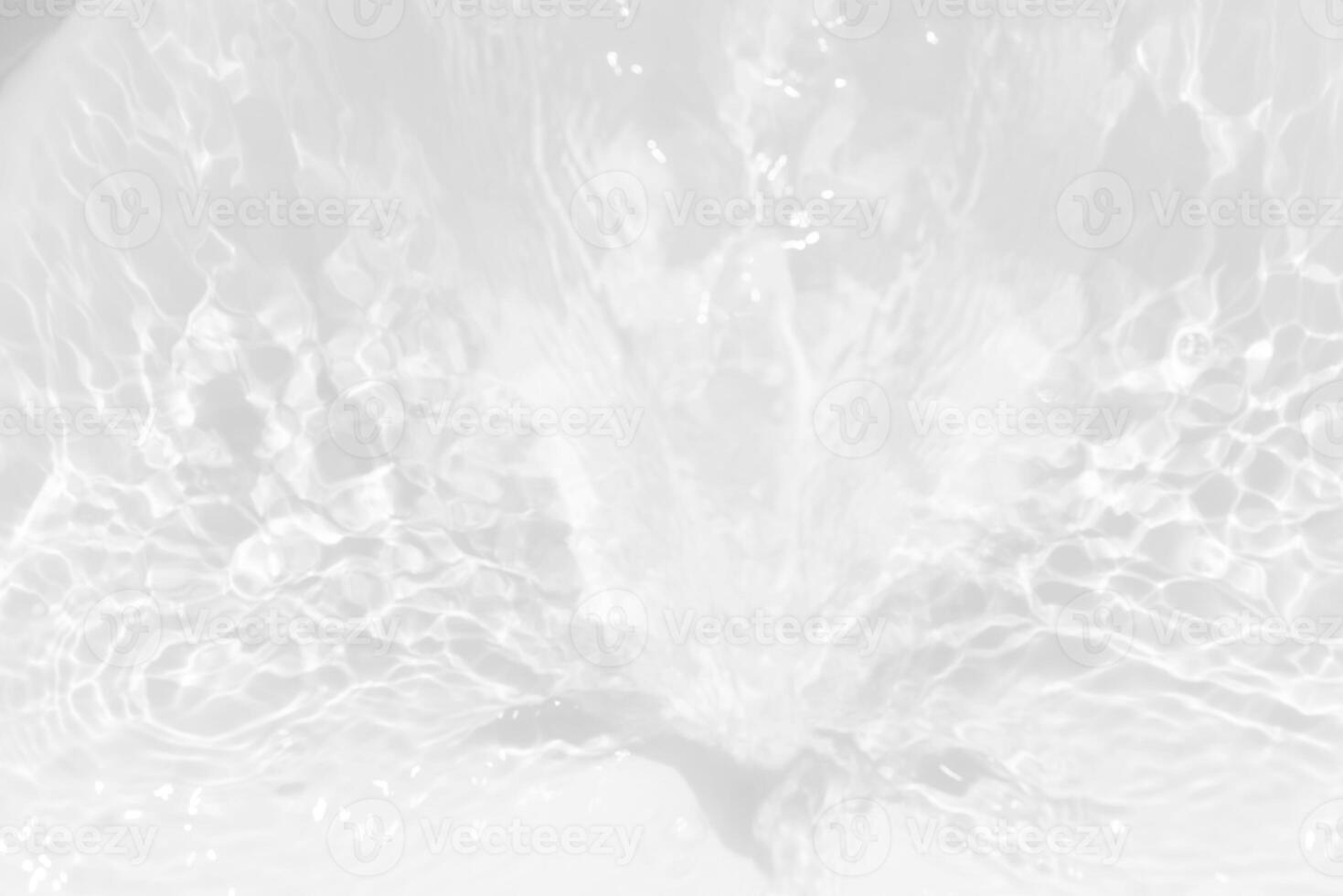 White water with ripples on the surface. Defocus blurred transparent white colored clear calm water surface texture with splashes and bubbles. Water waves with shining pattern texture background. photo