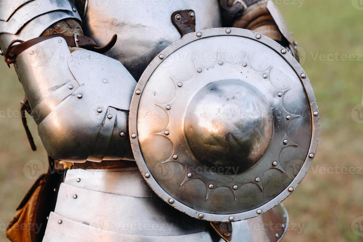 An ancient shield of ancient knight's armor.A medieval concept.Metallic texture photo