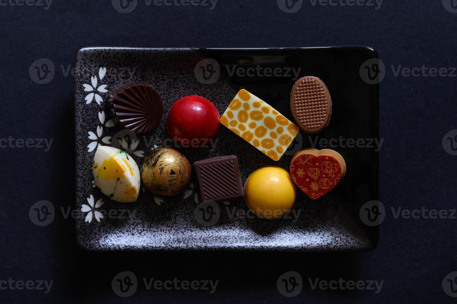 Small plate with delicious chocolate on it photo