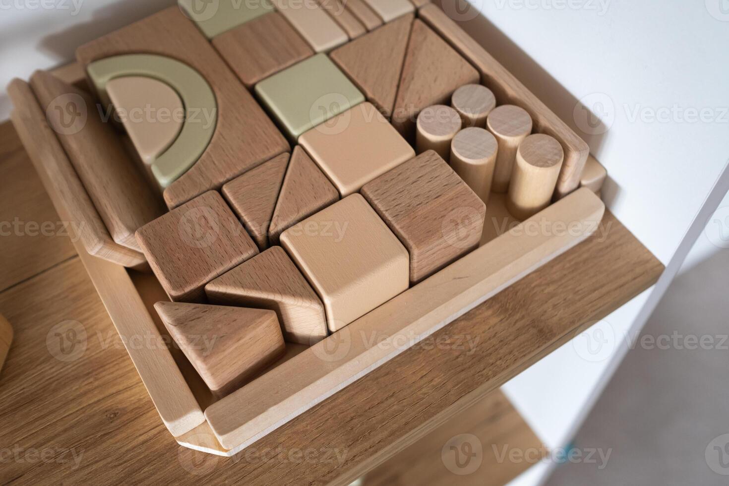 A shelf with children's wooden toys in the children's room. Children's concept photo