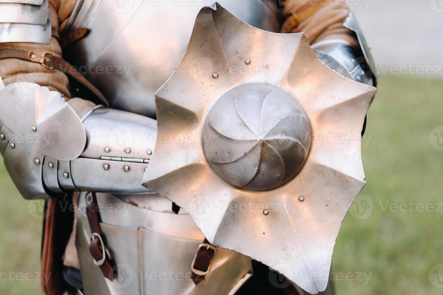 An ancient shield of ancient knight's armor.A medieval concept.Metallic texture photo