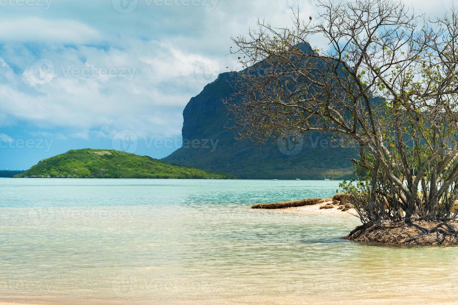 beach and mountain in Le Morne-Brabant.Coral reef of the island of Mauritius photo