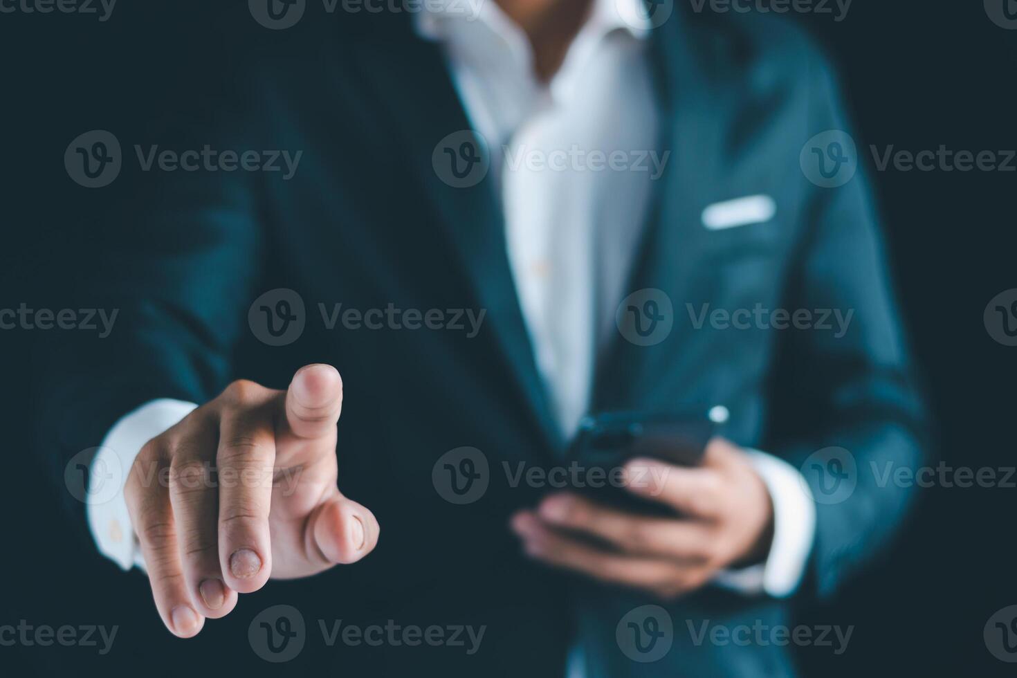 Businessman's hands working using a mobile phone photo