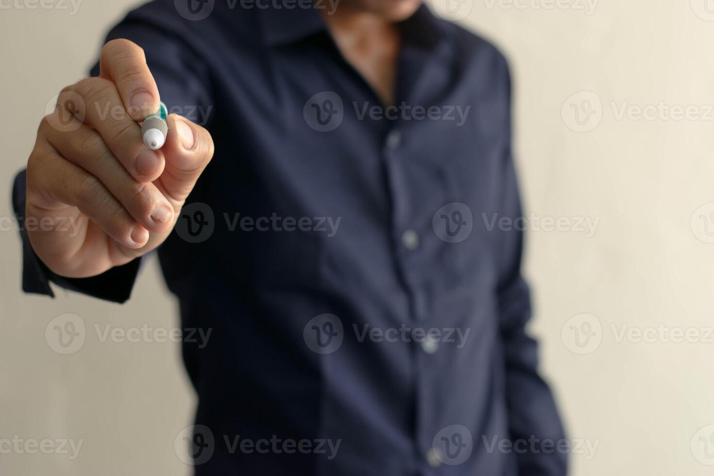 Man with pen in hand pointing at successful professional business work hand touch symbol or digital writing for work or education pointing concept photo
