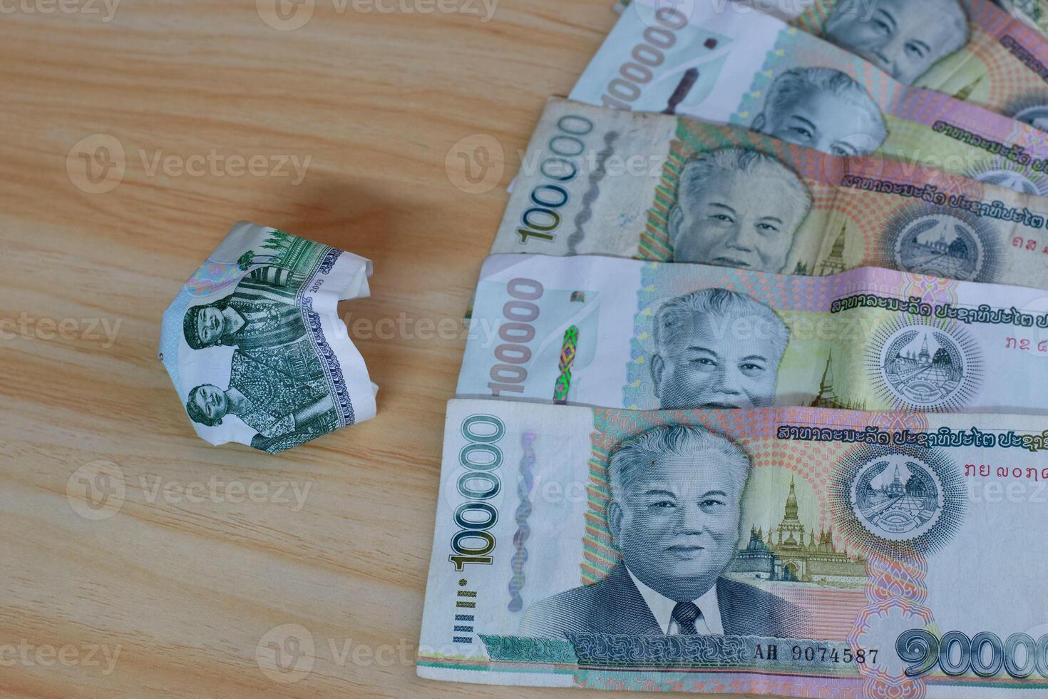The exchange rate today is 100 baht equal to sixty thousand Lao kips and continues to inflate On August 3, the Lao Kip continued to depreciate photo