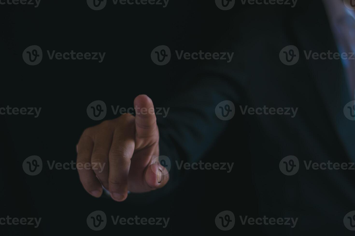 Businessman's hands working using a mobile phone photo