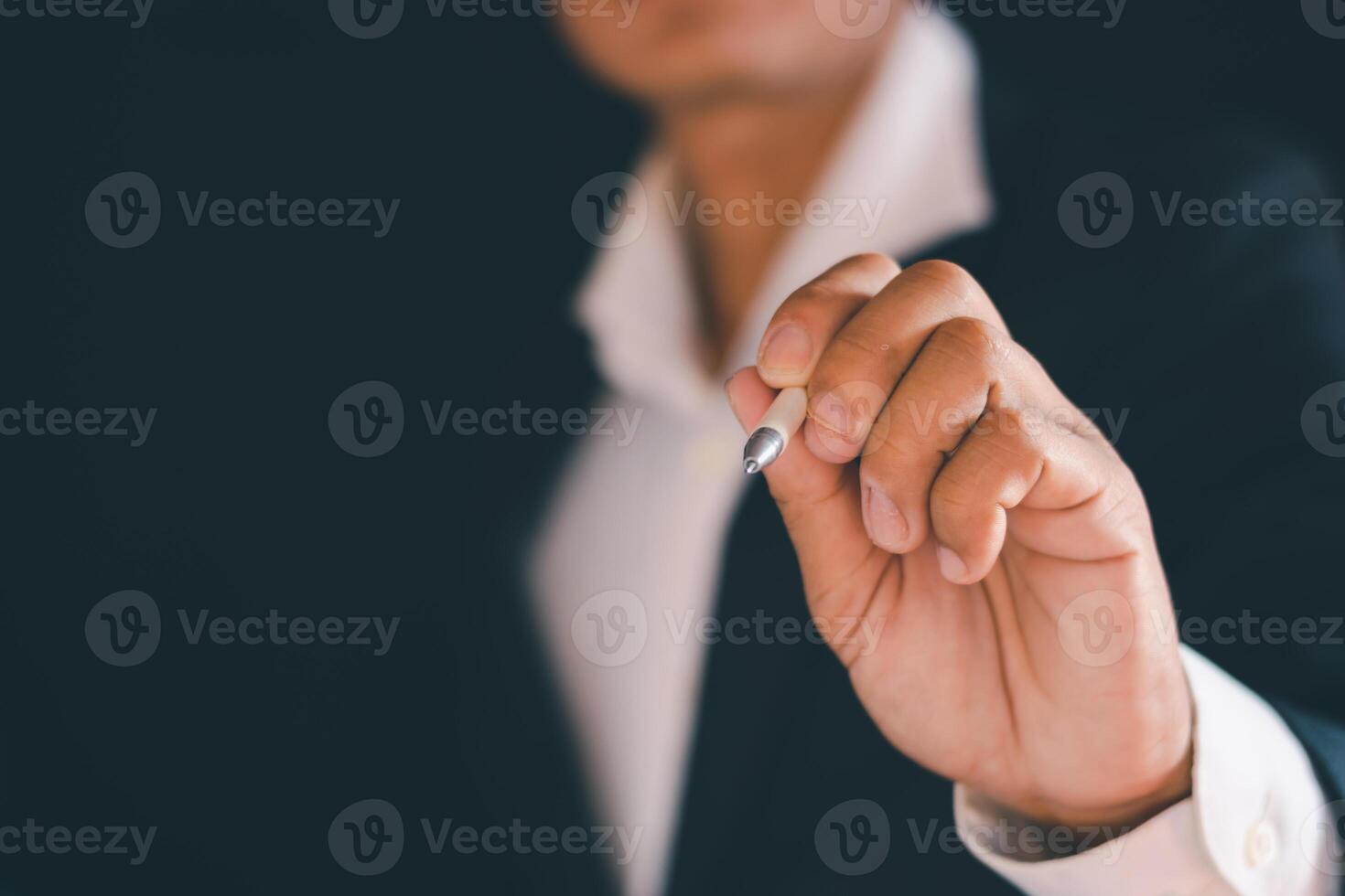 Businessman's hands working using a mobile phone photo