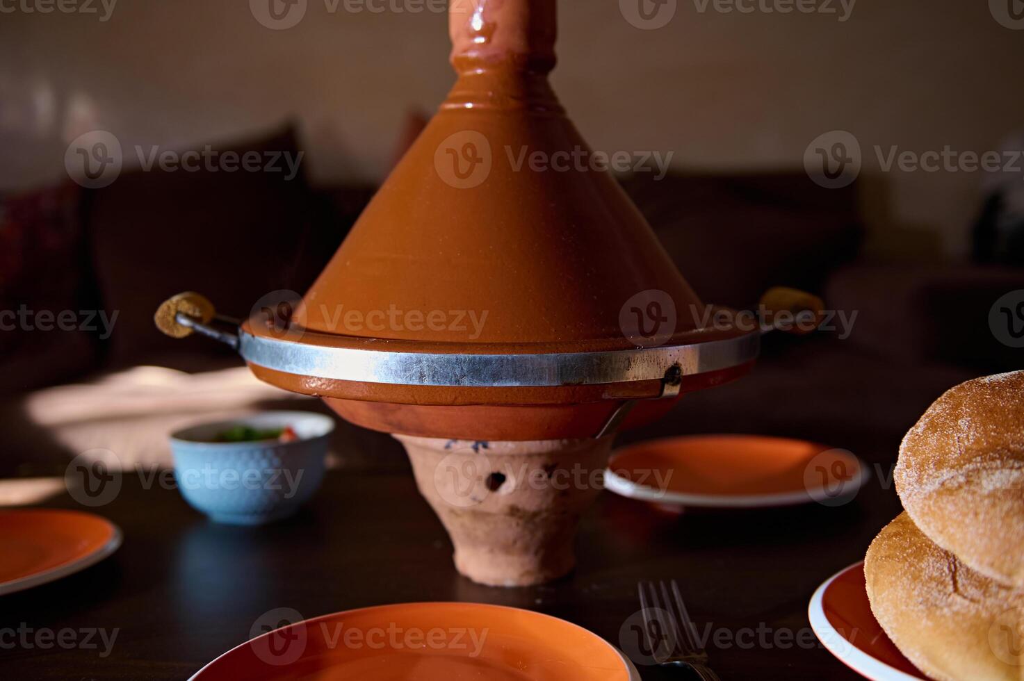 Traditional Moroccan Tagine served at home. Culinary. Cuisine. Culture and traditions of Morocco photo