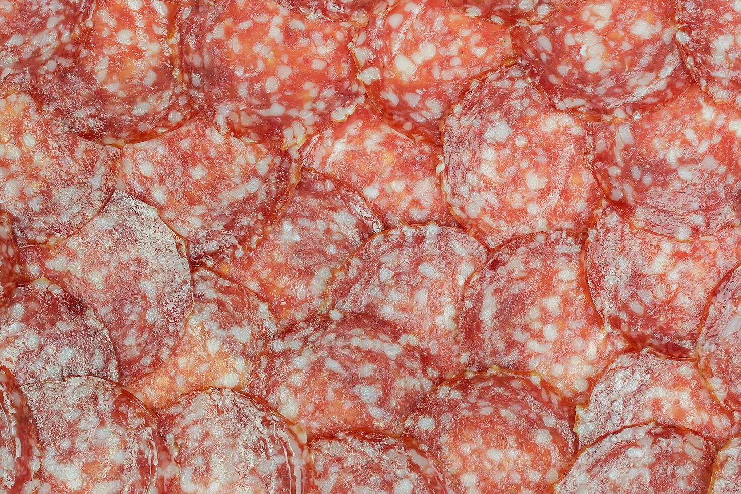 Sausage background texture, pattern from sausage slices photo