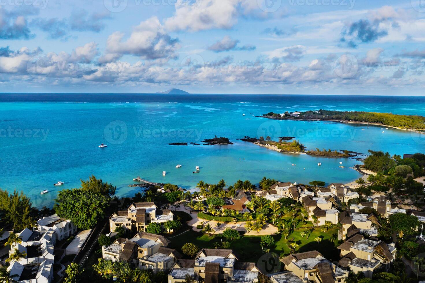 Aerial photography of a coral reef and a hotel complex with beaches in Mauritius, the North-East coast of the island of Mauritius. Beautiful lagoon of the island of Mauritius, taken from above. photo