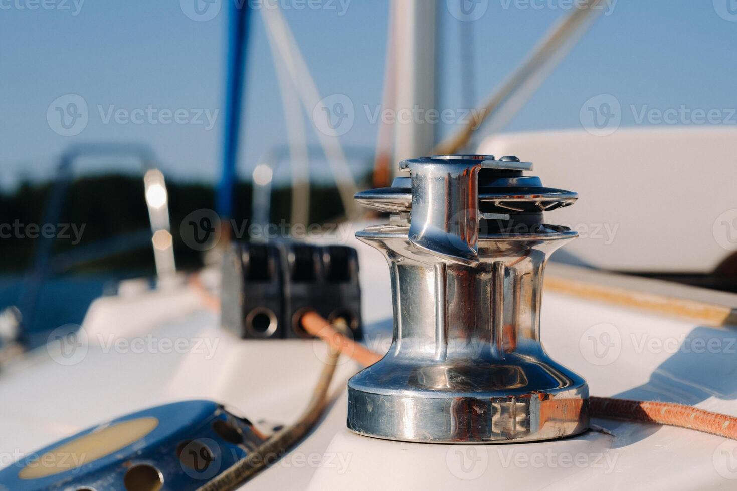 rope on the winch of a white yacht in the sea.yacht equipment photo