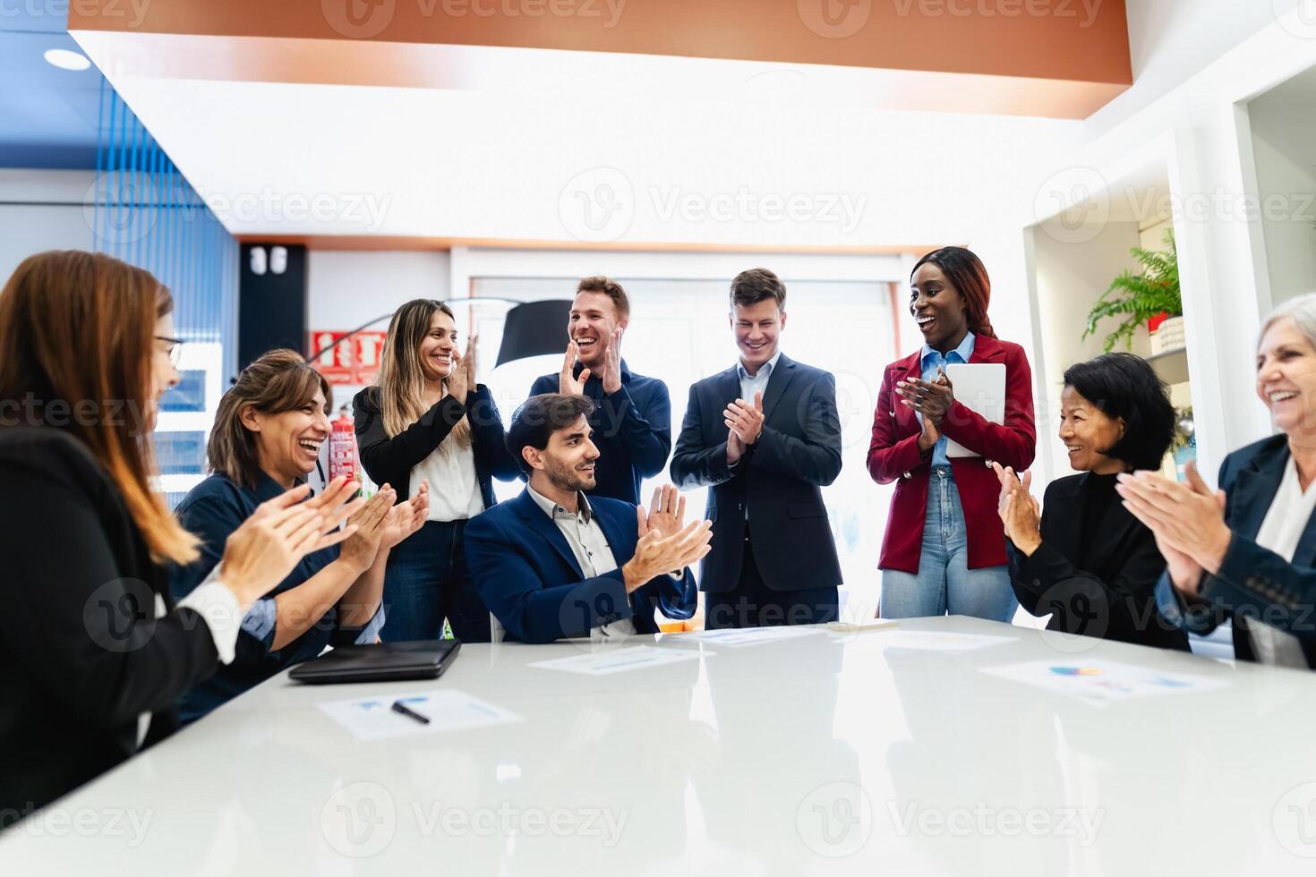 Group of multigenerational business team celebrating success in the office - Businesspeople with diverse age and ethnicity concept photo