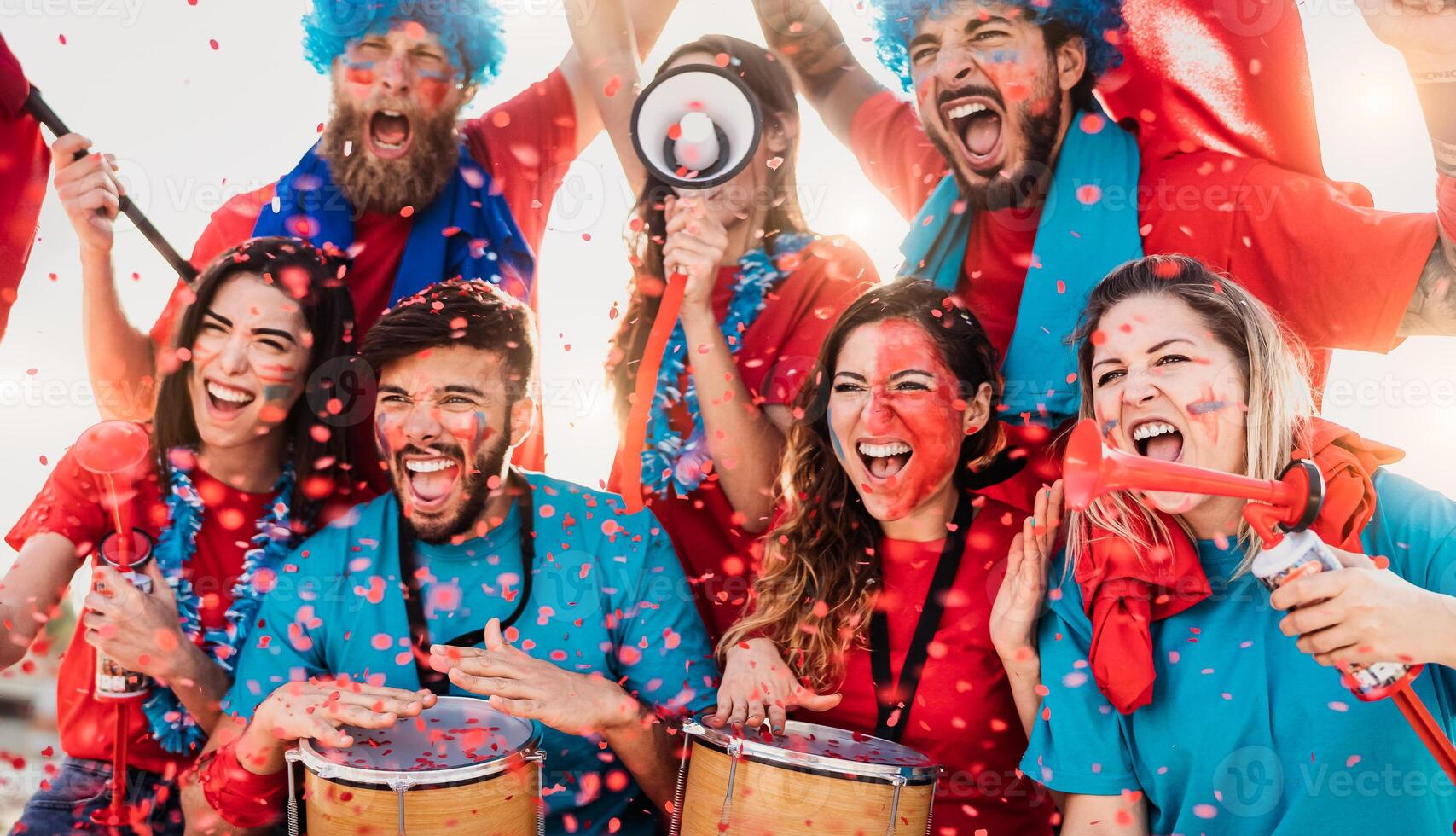 Football fans having fun cheering their favorite team - Soccer sport entertainment concept photo