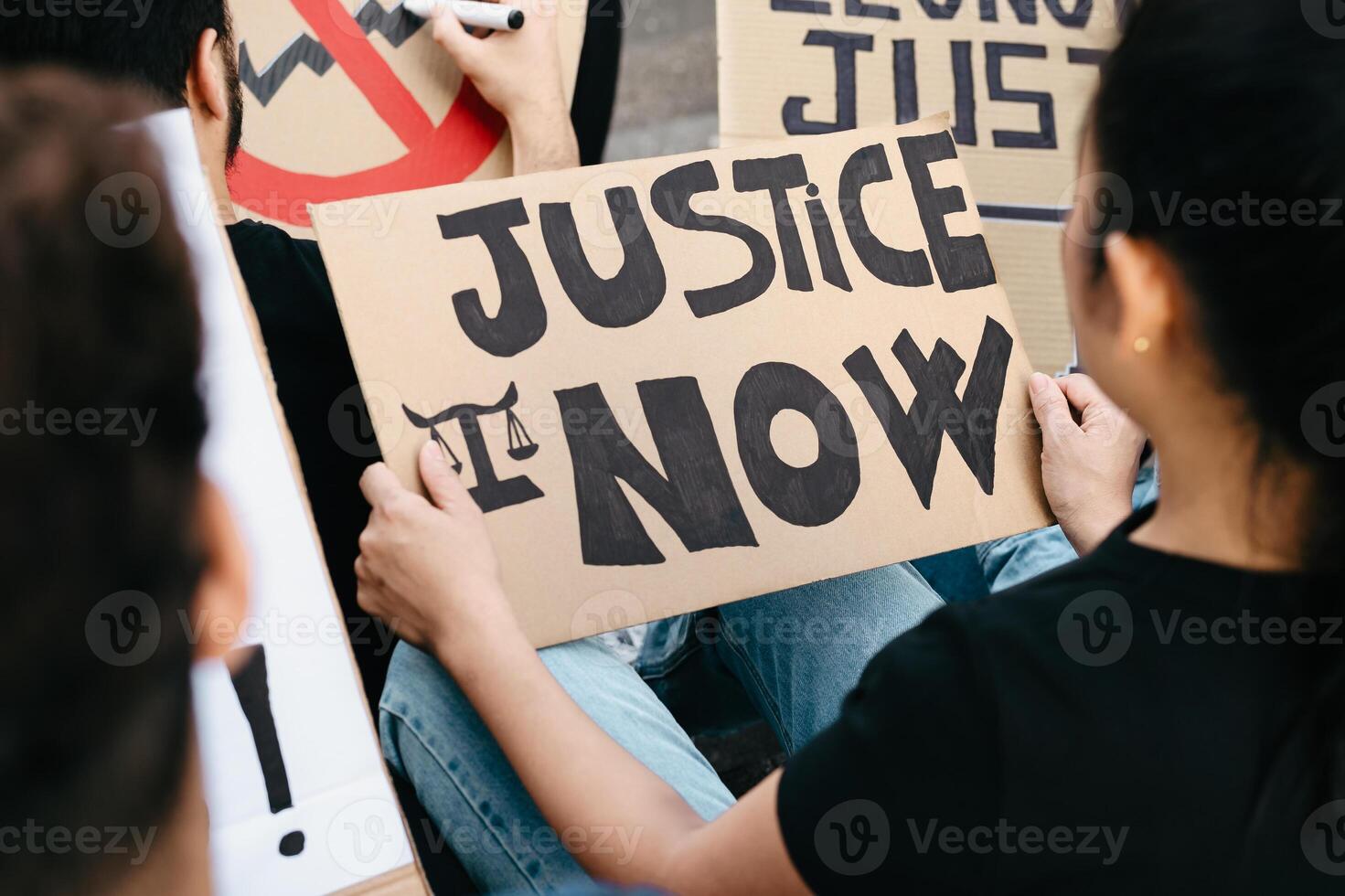 Activists protesting against financial crisis and global inflation - Activism and economic justice concept photo