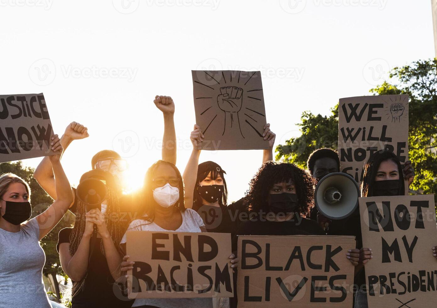 Activist movement protesting against racism and fighting for equality - Demonstrators from different cultures and race protest on street for equal rights - Black lives matter protests city concept photo
