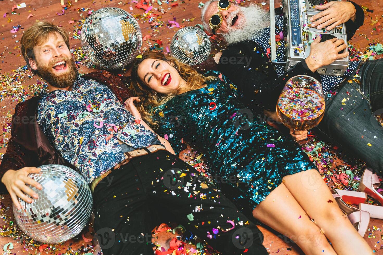 Happy party people with different age having fun celebrating holidays photo