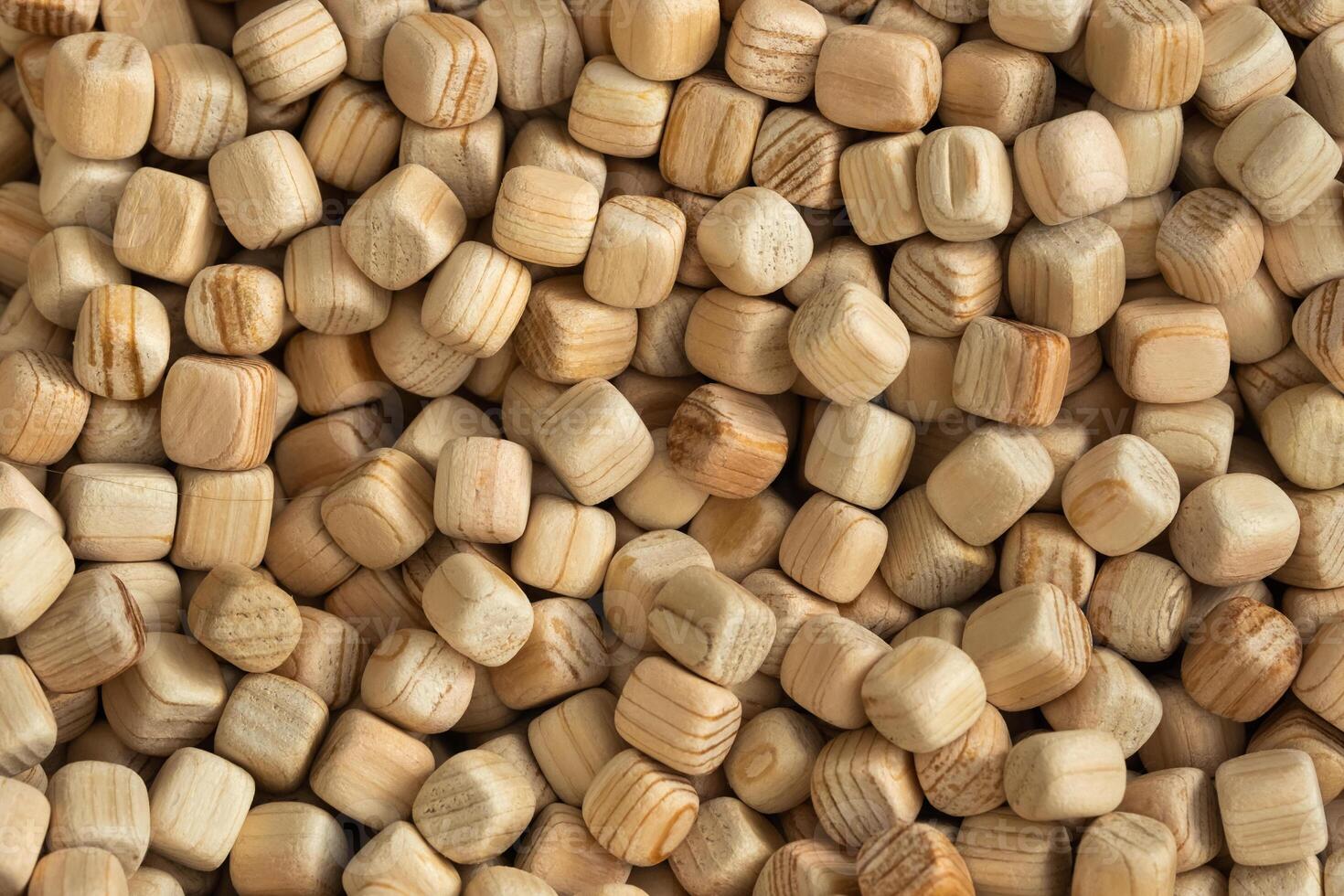 Lots of small wooden cubes. Background of wooden cubes photo
