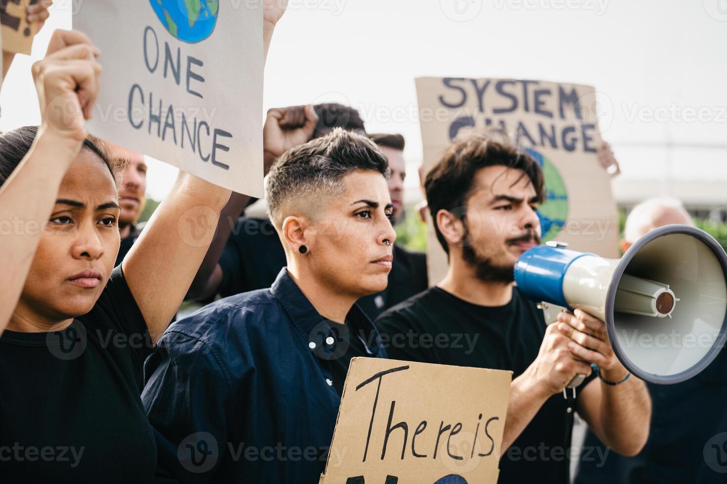 Demonstration of multiracial activists protesting for climate change - Global warming concept photo