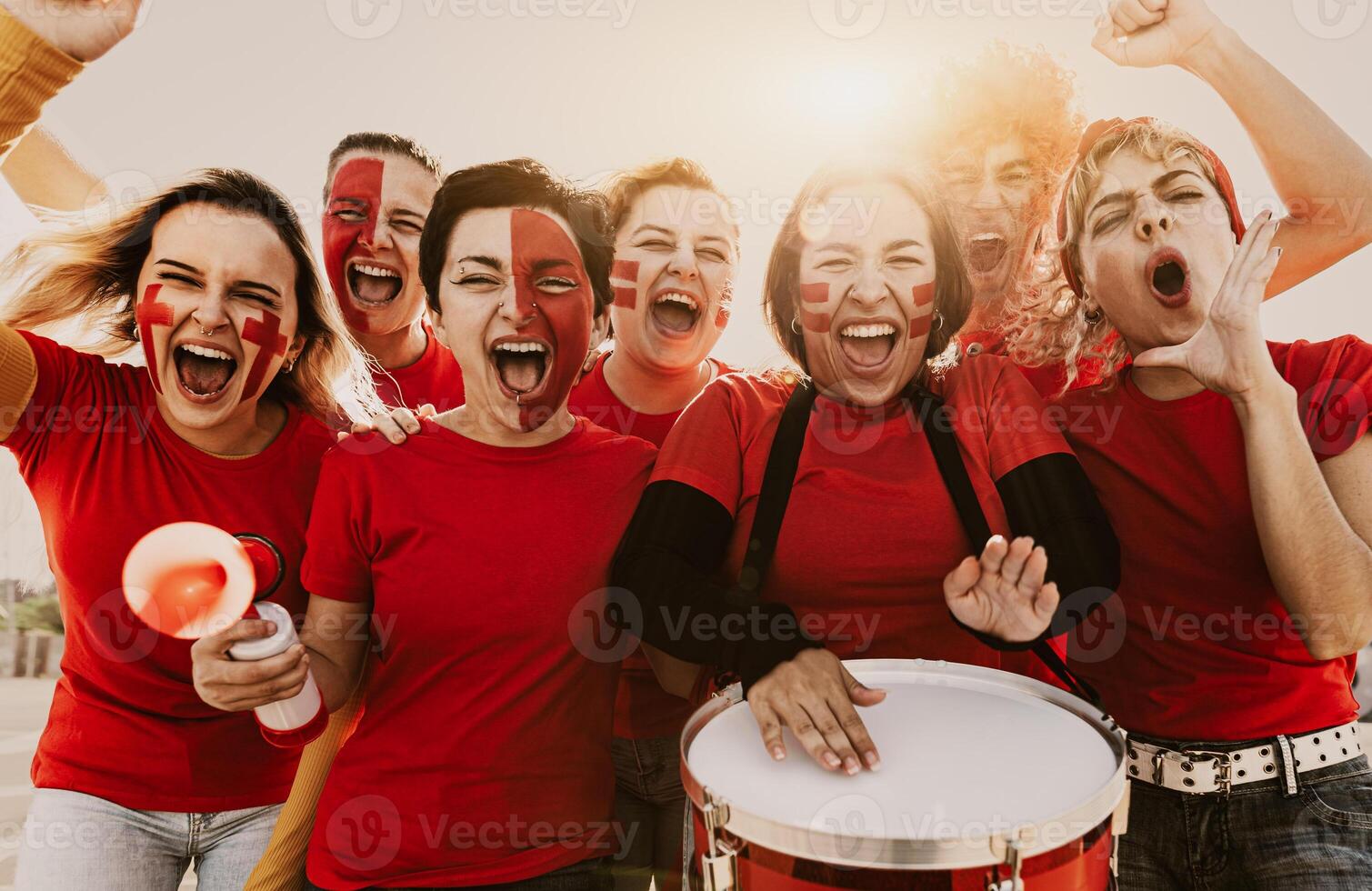 Women's football fans having fun cheering their favorite team - Soccer sport entertainment concept photo